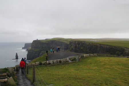 People walking in Cliffs of moher in Clare co., Irelandのeditorial素材