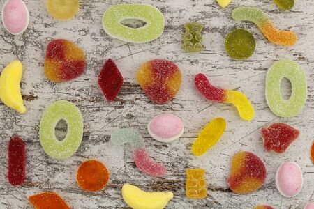 Sweet candies in a wood backgroundの写真素材