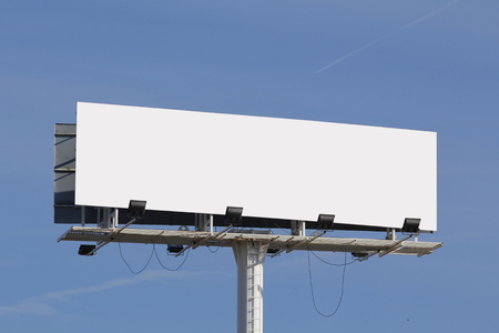 Blank billboard for advertising, against blue skyの写真素材