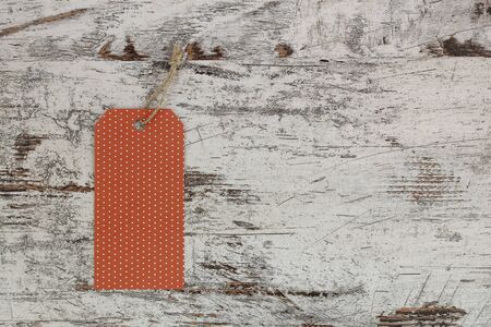 Paper tag in a wood background, for packaging