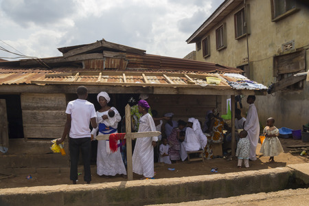 Akure, Nigeria - August 12 2012: Some african people dressing white clothes, in a religious ceremony at the city of Akure, Nigeria, on August 12, 2012のeditorial素材