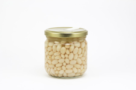 Canned beans in a glass jar, isolated in a white backgroundの写真素材
