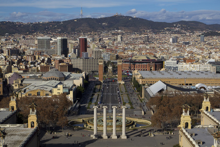 BARCELONA, SPAIN - JANUARY 10, 2016: City view of Barcelona with the Montjuic fountain, the famous towers of Plaza Espana and the mountain of Collserola and Tibidabo in the background, in the city of Barcelona, Spain on January 10, 2016のeditorial素材