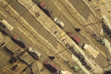 Street reflections, with cars and peopleの写真素材