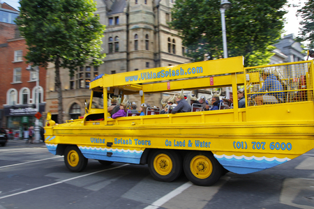 DUBLIN, IRELAND - AUGUST 03, 2015: Tourists take a tour with a Viking amphibious vehicle in the streets of the center of Dublin in Ireland, on August 03, 2015のeditorial素材