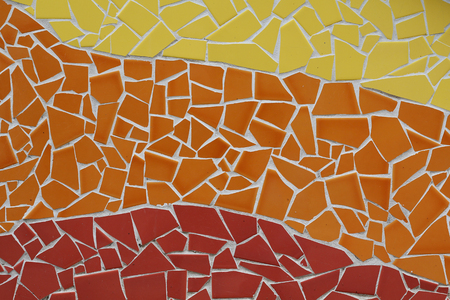 Trencadis mosaic of small ceramic pieces, in orange tonesの写真素材
