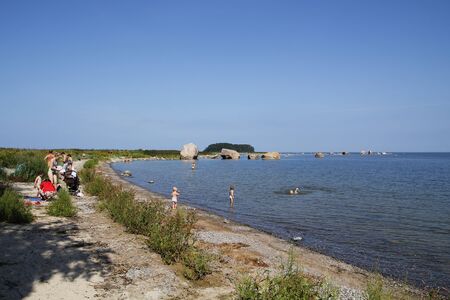 KASMU, ESTONIA - JULY 27, 2016:  People having fun in the beach of KÃ¤smu Peninsula in northern Estonia, on the territory of Lahemaa National Park, surrounded by the Eru Bay to the west and the KÃ¤smu Bay to the east.のeditorial素材