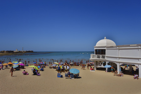 CADIZ SPAIN - AUGUST 06, 2016: People having fun on the Caleta beach in Cadiz, a touristic destination in the south of Spain, a hot sunny day on August 06, 2016のeditorial素材