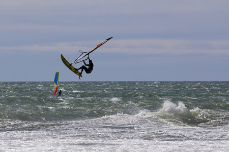 Windsurf acrobatic jump in the seaの写真素材