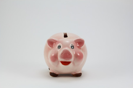 Ceramic pig piggy box, isolated in a white backgroundの写真素材