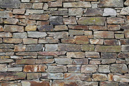 Stone wall background, traditional construction wayの写真素材