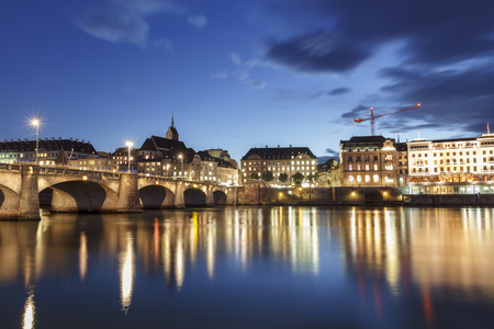 Middle bridge over the river Rhine in Basel, Switzerland, illuminated at duskのeditorial素材