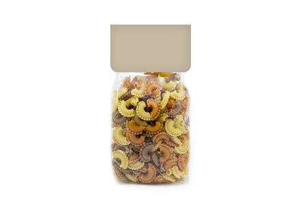 Pasta in a transparent plastic packaging, with a blank label in the topの写真素材