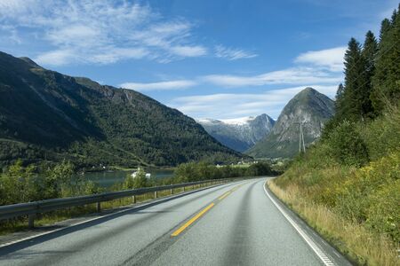 Mountain road with Josteldalsbreen glacier in the background, Norwayの写真素材