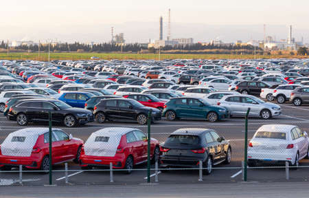 Import of new cars for sale in a parking, automotive industryの写真素材