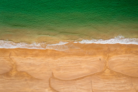 Aerial View Over Clear Waters of Park Bay Beach, Antrim, Northern Ireland ,United Kingdom