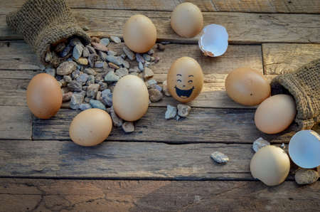 eggs smile on the woodの写真素材