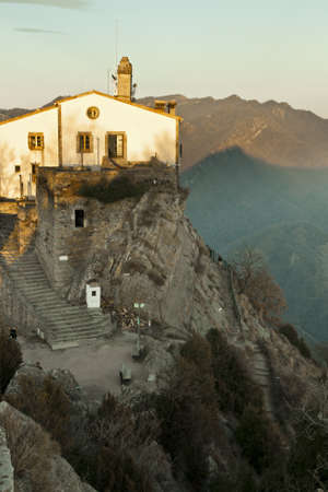 monastery at sunset on the top of mountainの写真素材