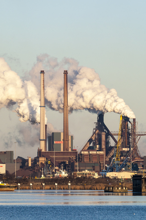 Hoogovens met rokende schoorstenen in IJmuiden; Blast furnaces with smoking chimneys at IJmuidenのeditorial素材