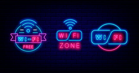 Wifi neon label collection. Internet signs on brick wall. Multicolored emblems for cafe and bar. free wifi zone. Glowing effect badges set on brick wall. Vector stock illustrationの写真素材