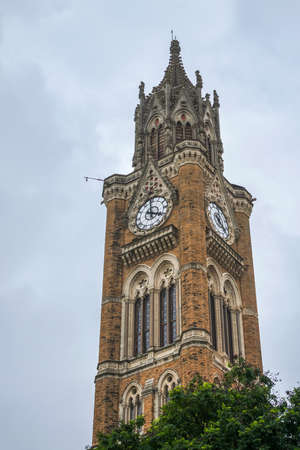 The iconic Rajabai Clock Tower, a symbol of the heritage of Mumbai, Indiaのeditorial素材