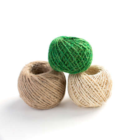 Three isolated skeins of thread for handcraft