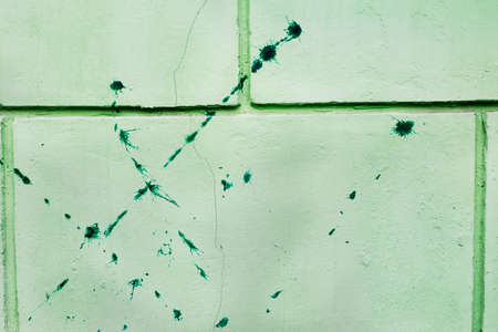 Dirty spots on green painted wall - horizontal backgroundの写真素材