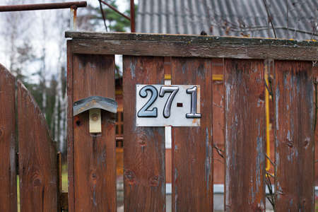 Number of rural house attached to brown fenceの写真素材