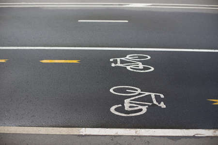 Sign of bicycle lane on wet asphaltの写真素材