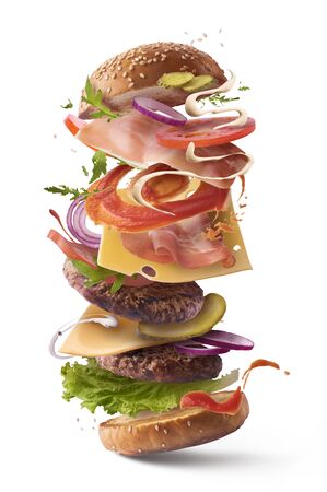 Delicious burger with flying ingredients isolated on white backgroundの写真素材