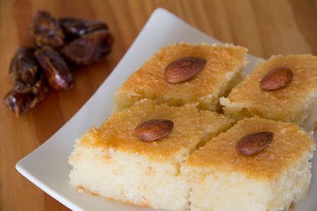 Basbousa with Dates on a Table