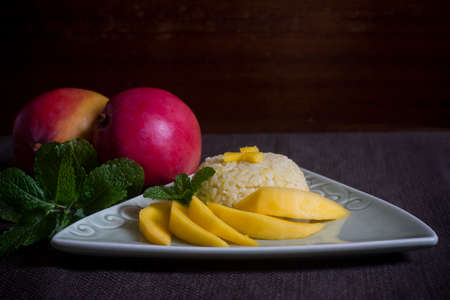 Thai Sticky Rice with Mango on a Tableの写真素材