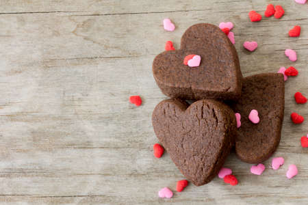 Heart Cookies on Table with Sprinkles Close Upの写真素材