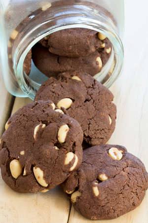 Peanut Brownie Cookies in a Jar on Table from Above - Vertical