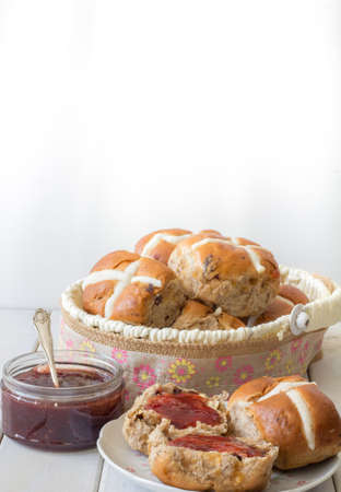 Hot Cross Buns in an Easter Basket Vertical with Copy Space