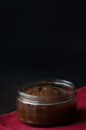 Chocolate Souffle on a Red Napkin and Dark Background from the Front Verticalの写真素材