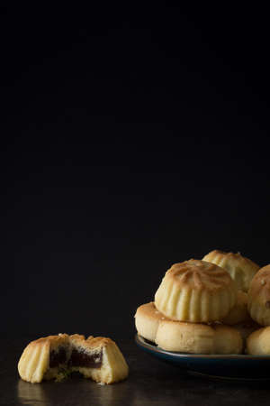 Middle Eastern Eid Cookies Filled with Dates on Dark Background Horizontal with Copy Spaceの写真素材