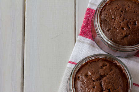 Chocolate Souffle From Above on White Table with Copy Space