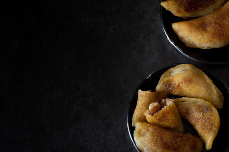 Homemade Qatayef from Above on Dark Background from Above with Copy Space Left