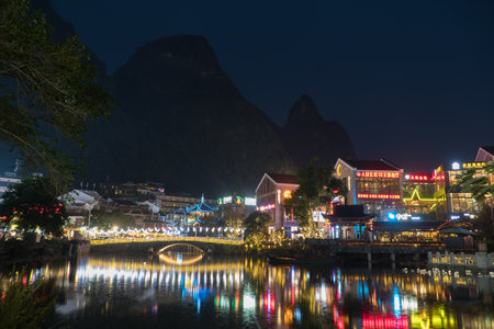 YANGSHUO CHINA, NOV 23: Yangshuo at Night with Karst Mountain in Background Nov 23 2017のeditorial素材
