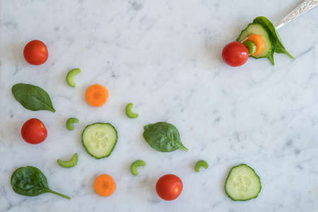 Pattern of Salad Ingredients on Marble Bench Top, Baby Spinach Leaves, Carrot, Cherry Tomatoes,...