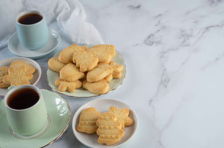 Setting of Christmas Shortbread and Tea on Marble Table Top View with Copy Space