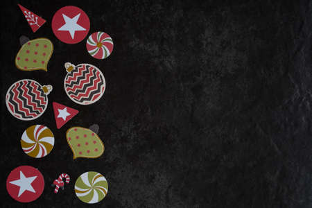 Circle of Paper Christmas Decorations on Dark Background with Copy Space