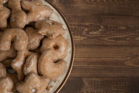 Assortment of Nuremberg Christmas Cookies on a Plate on a Wooden Table from Above with Selective Focus and Copy Spaceの写真素材