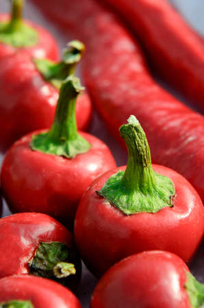 Many fresh red ripe sweet pepperの写真素材