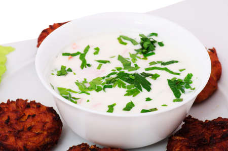 Indian food: yogurt salad and vegetable pies.の写真素材