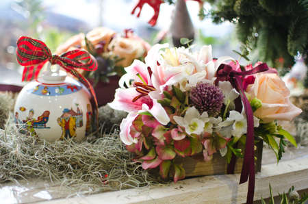 A fancy market with flowers in baskets and nice decorations.の写真素材