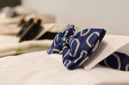 Man shirt with bow tie in a luxury clothing store.の写真素材