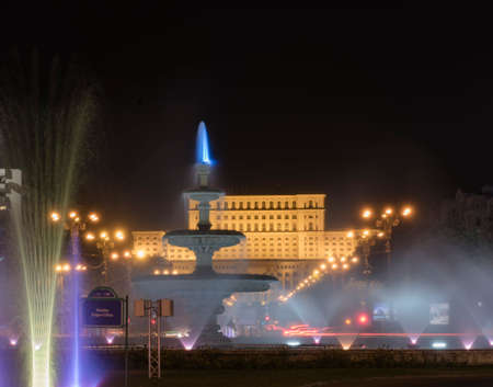 Bucharest, Romania  August 4, 2015: Night scene in front of Parliament Palace, the second large administrative building in the world.のeditorial素材