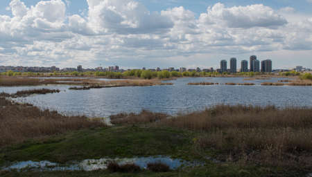 Bucharest, Romania - April 2, 2015: Urban contrast between Asmita Garden residential buildings and wild delta Vacaresti in south-eastern Bucharest.のeditorial素材